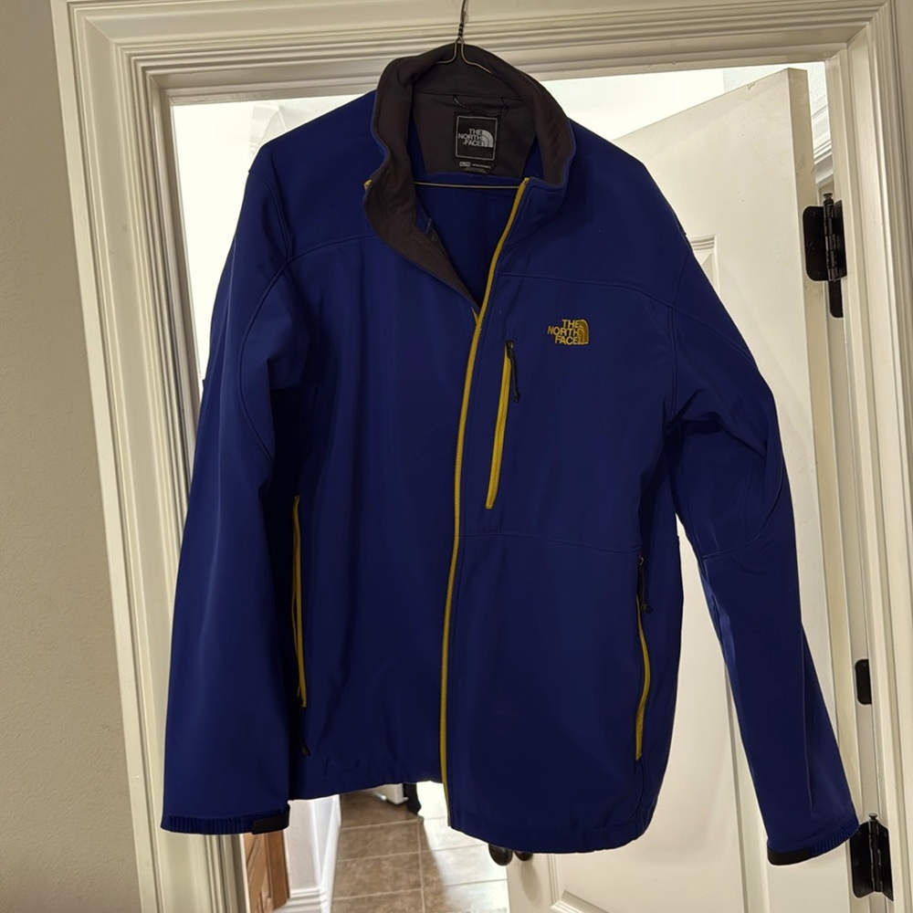 The North Face XL jacket withhard shell with fleece liner. Like new!